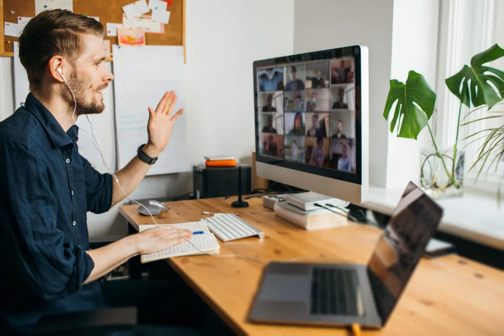 Young man having video conferencing call via computer.